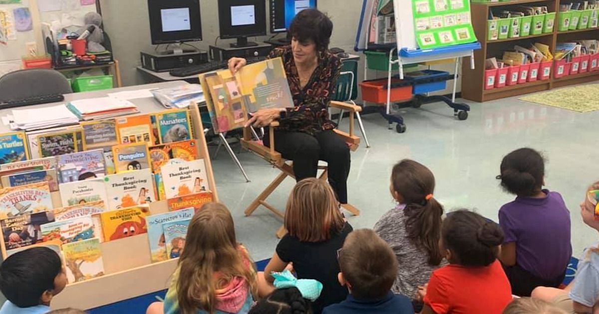Karen Brill Reading to Students