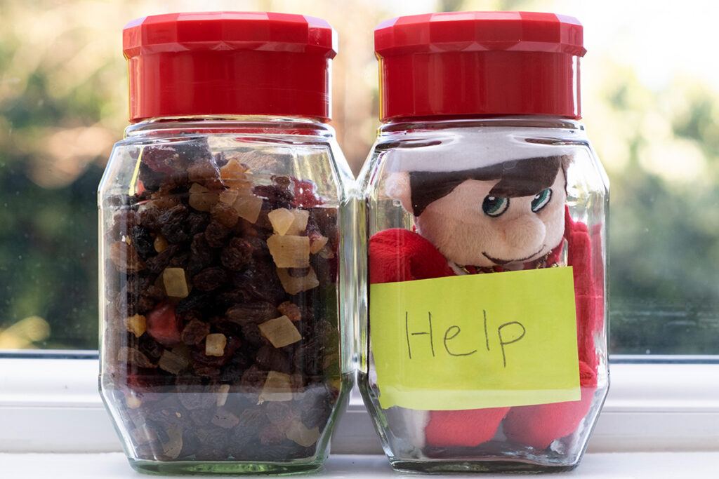 Elf on the Shelf trapped in a jar